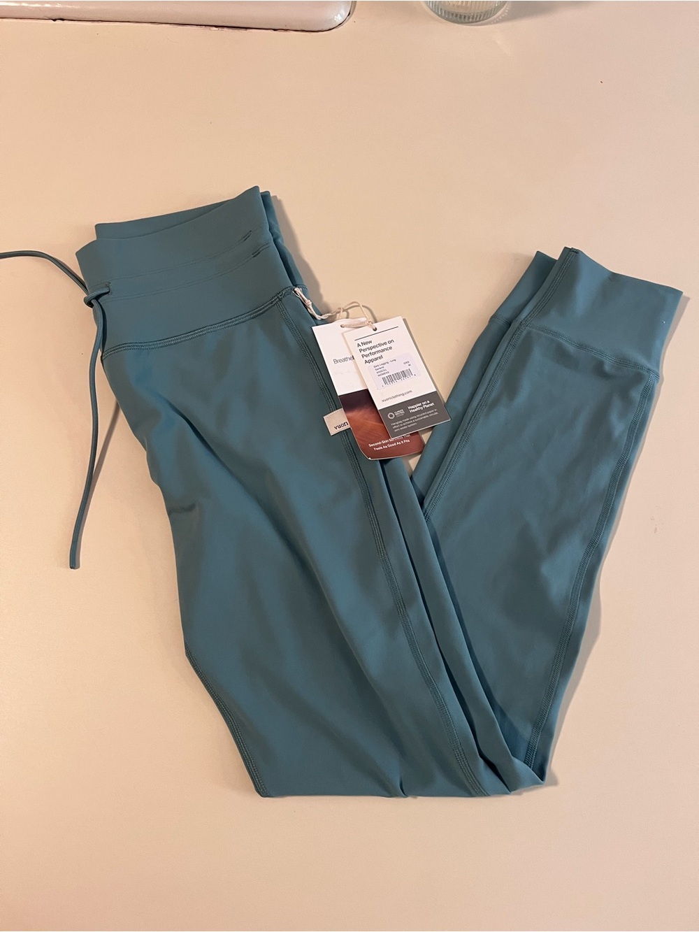 Vuori High-Rise Leggings in Teal
